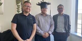Fabian Brucker with Ben Hermann and Falk Howar after defending his doctoral dissertation