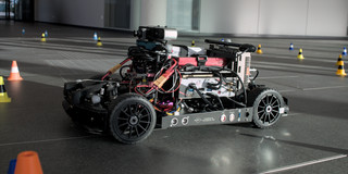 The AADC model car is being prepared for an autonomous race at the TU's 2023 Open House.